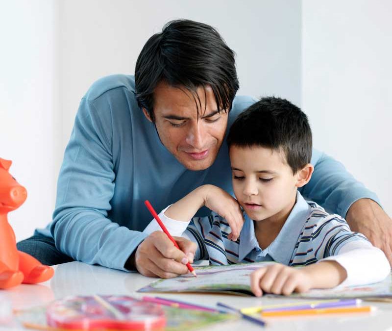 Homeschooling Considerations - Adult teaching child